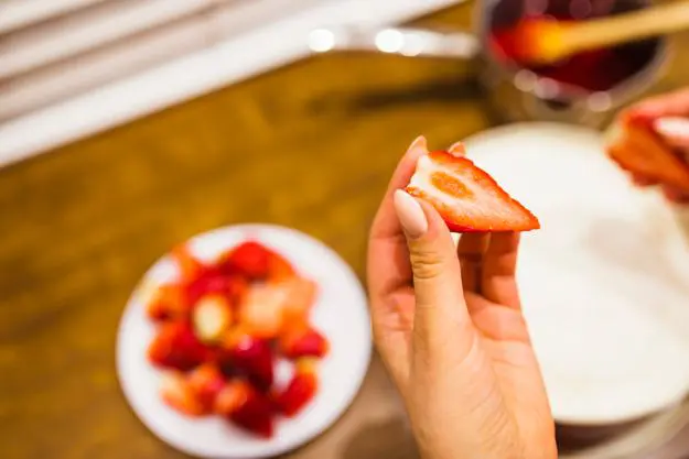 cutting-strawberries-into-half