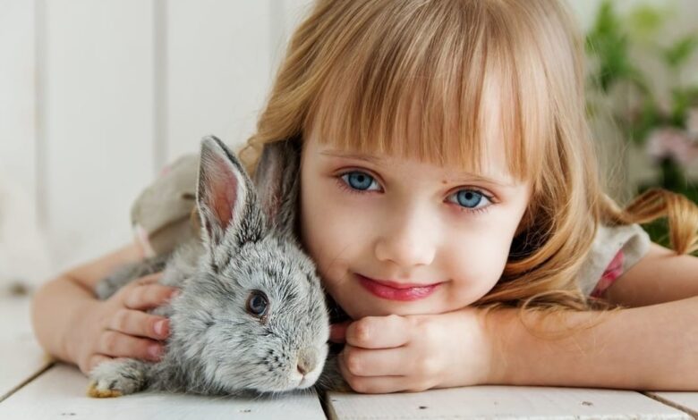 little girl holding her bunny